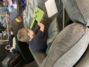 School-aged child reading to himself