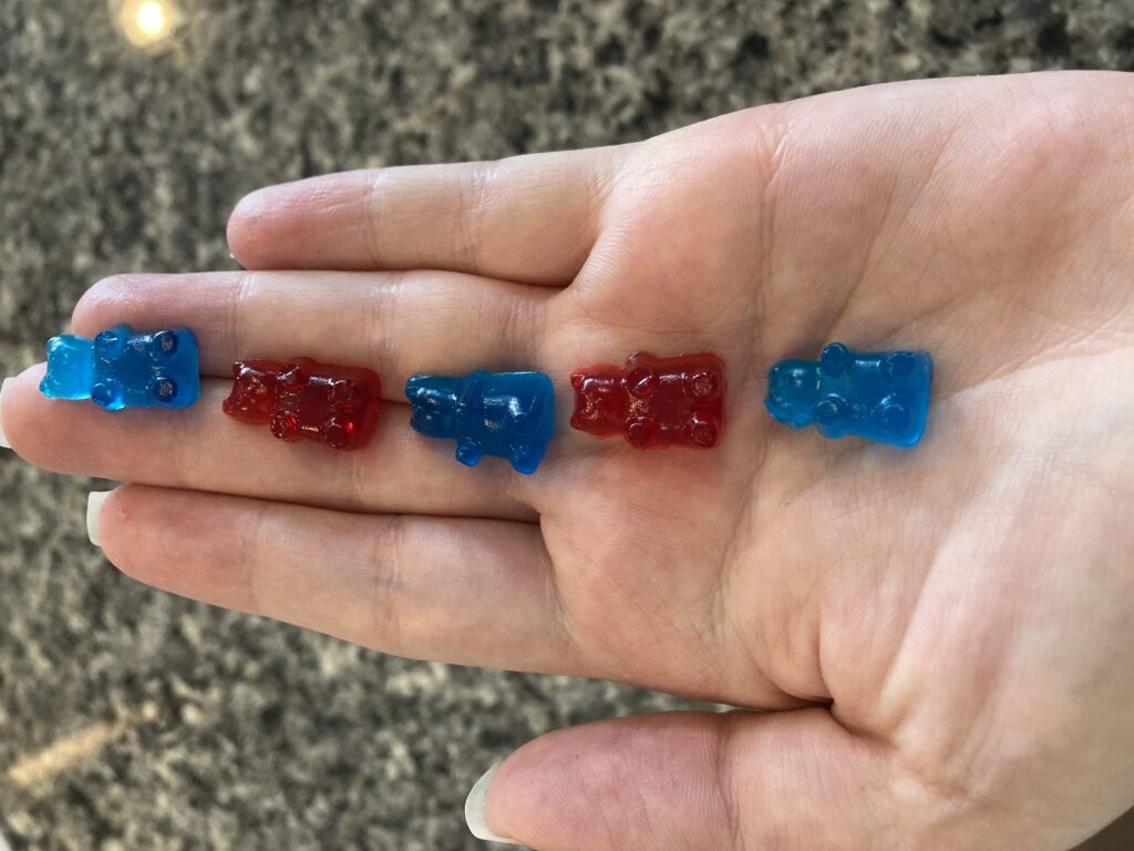 Red and Blue Gummy Bears in my hand