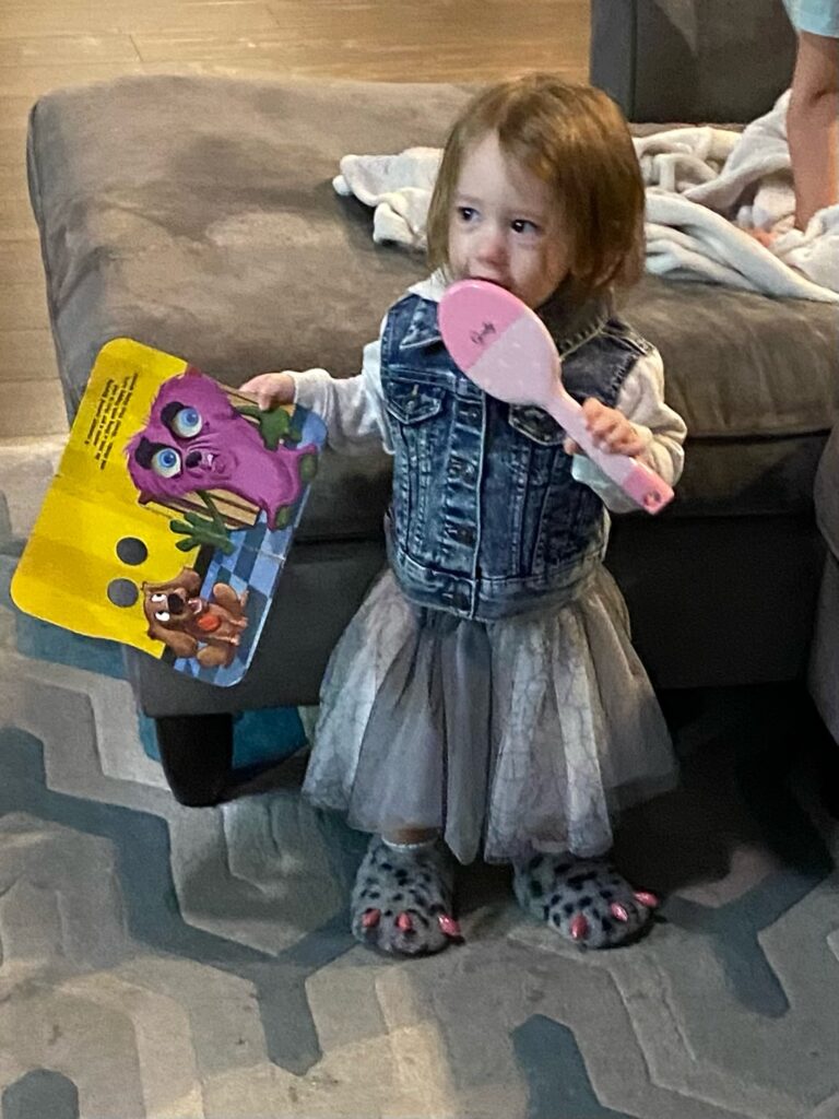 Baby reading monster book